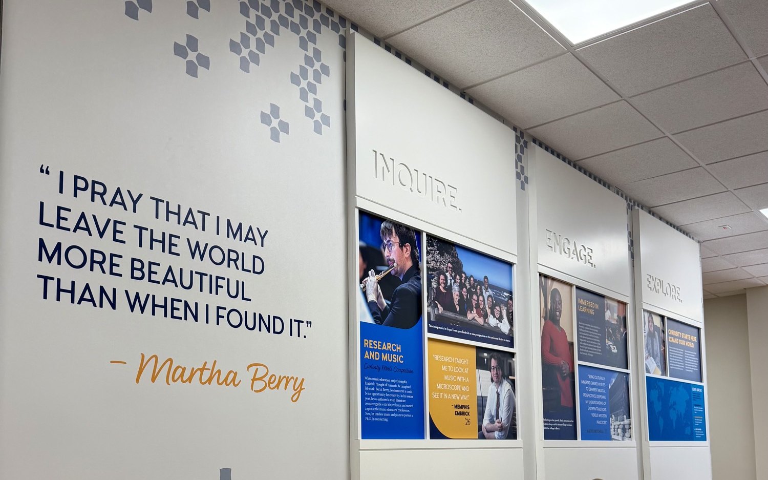 Berry College Evans School of Business story wall with Martha Berry quote and Inquire Engage Explore panels