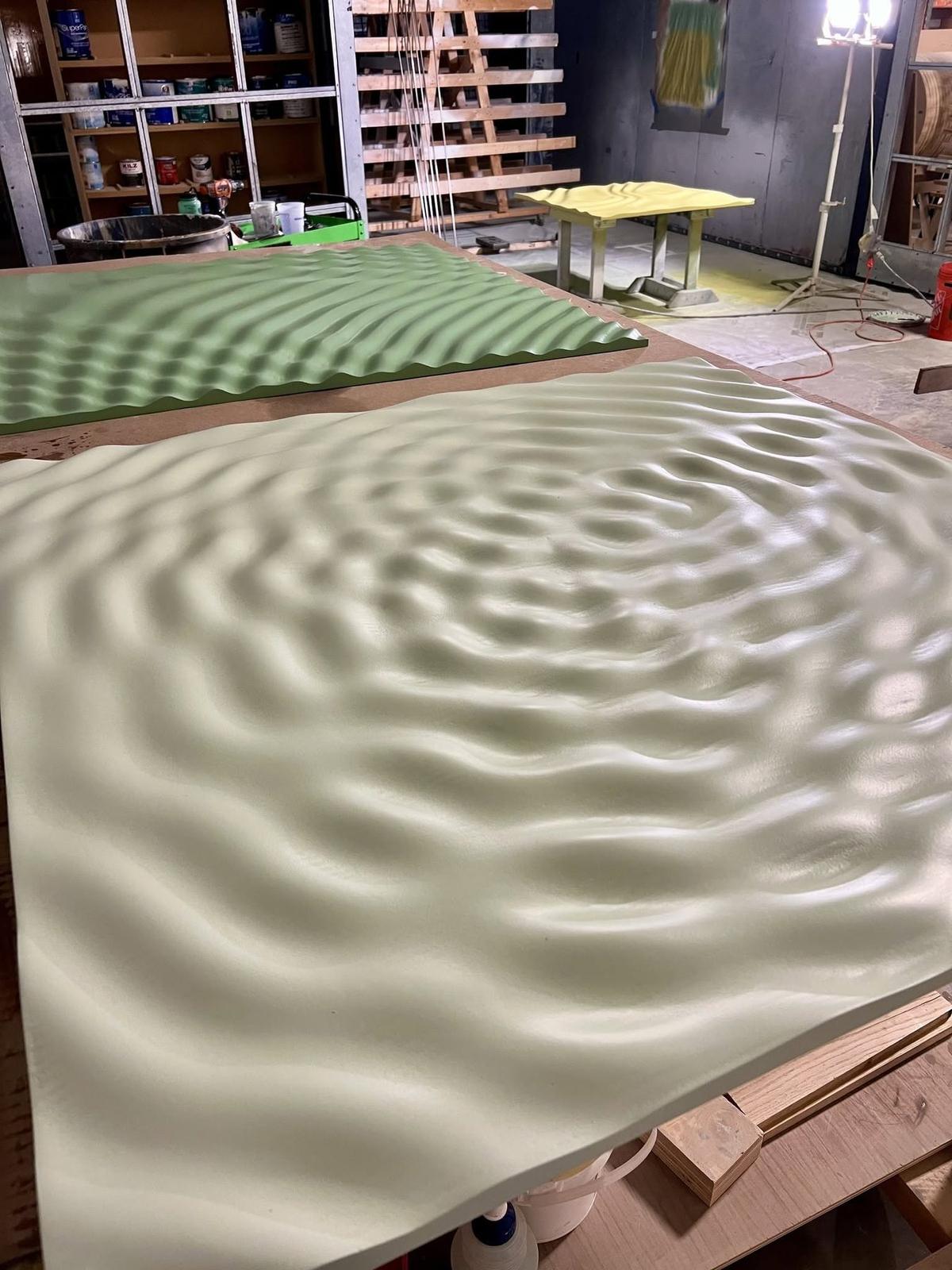 CNC carved ripple panels in the Peachtree Corners shop, waiting on finish