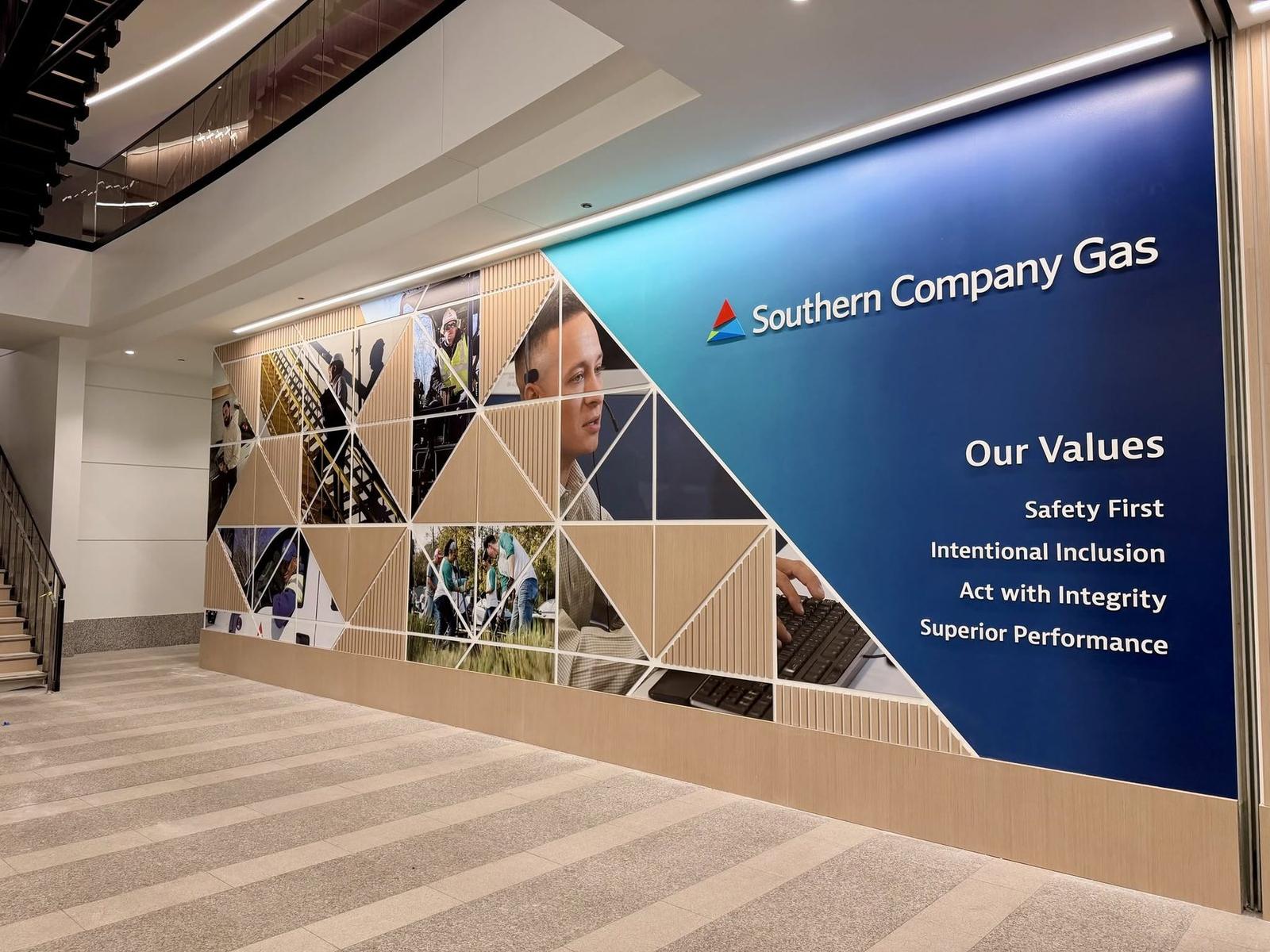 Corporate values wall with triangular photo millwork